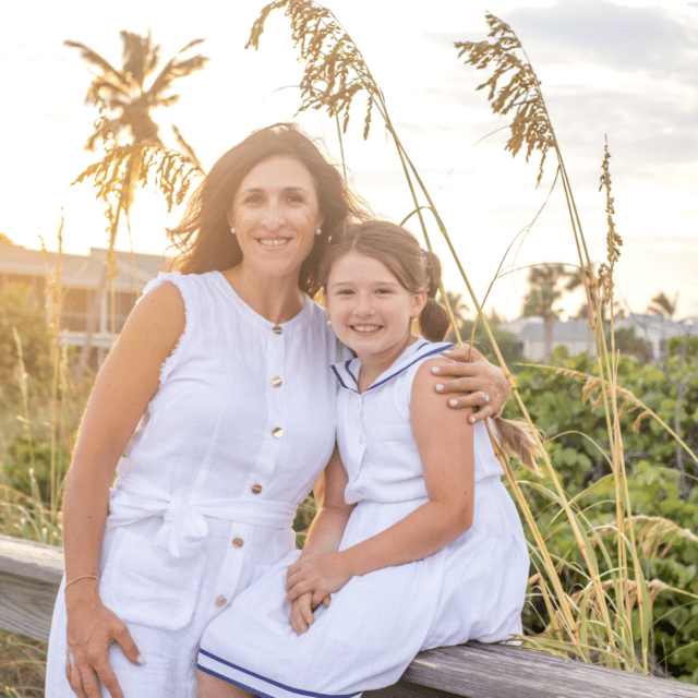 longboat key photography session by siesta key family photographer at sunrise with palm trees and sea oats in the background